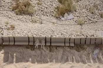 Image may contain: Composite material, Pipe, Pipeline transport, Sand.